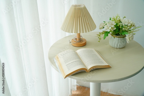 Table lamp and book on table in living room interior - Vintage Light Filter