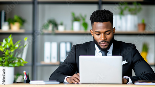 Professional Black Man in Office Working on Laptop