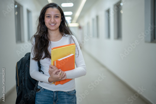 Serious focused indian young woman college university school student hold read book
