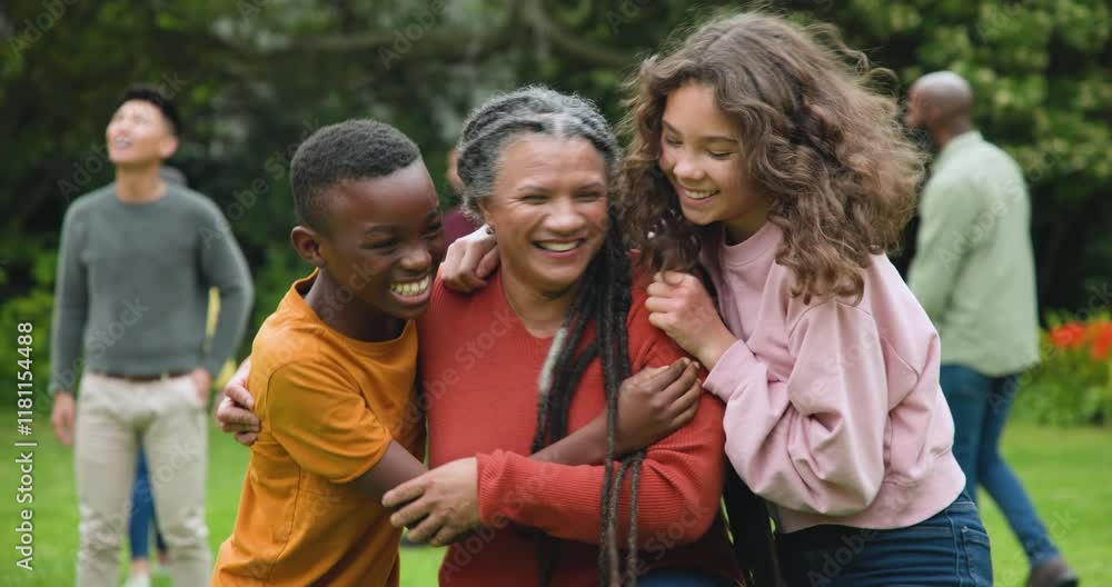 Diverse family laughing and hugging outdoors, enjoying quality time together Diverse family laughing and hugging outdoors, enjoying quality time together
