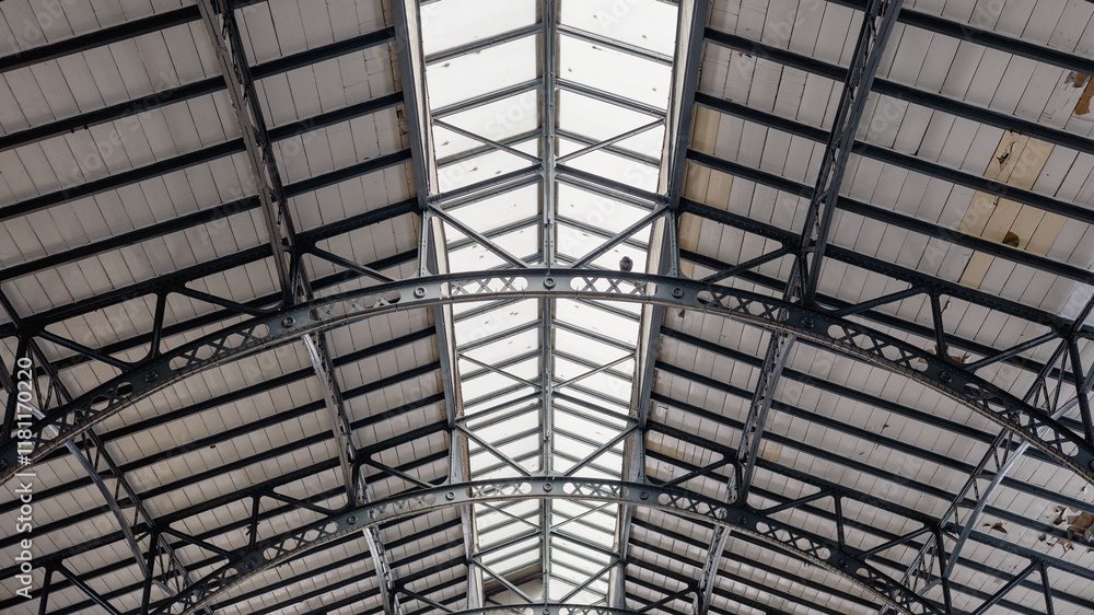 Metal roof construction of pula indoor market. Beautiful old time roof with metal support and wooden boards on top.