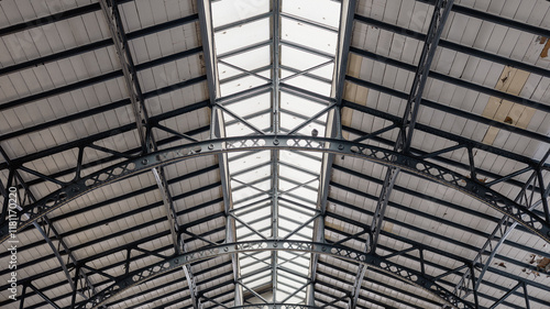 Obraz na płótnie Metal roof construction of pula indoor market. Beautiful old time roof with metal support and wooden boards on top. w salonie