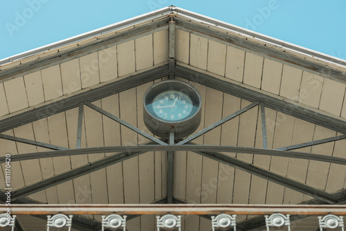 Obraz na płótnie Detail of a time clock on the roof of pula market building, nice ornament, wooden roof and metal railing around w salonie