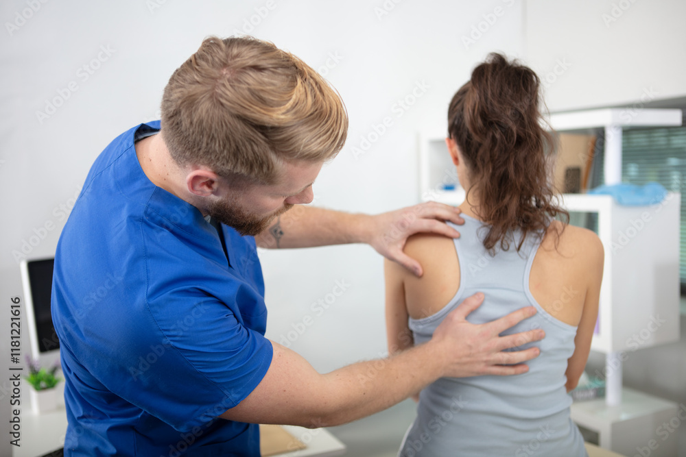 Fototapeta premium physiotherapist working with patient in clinic