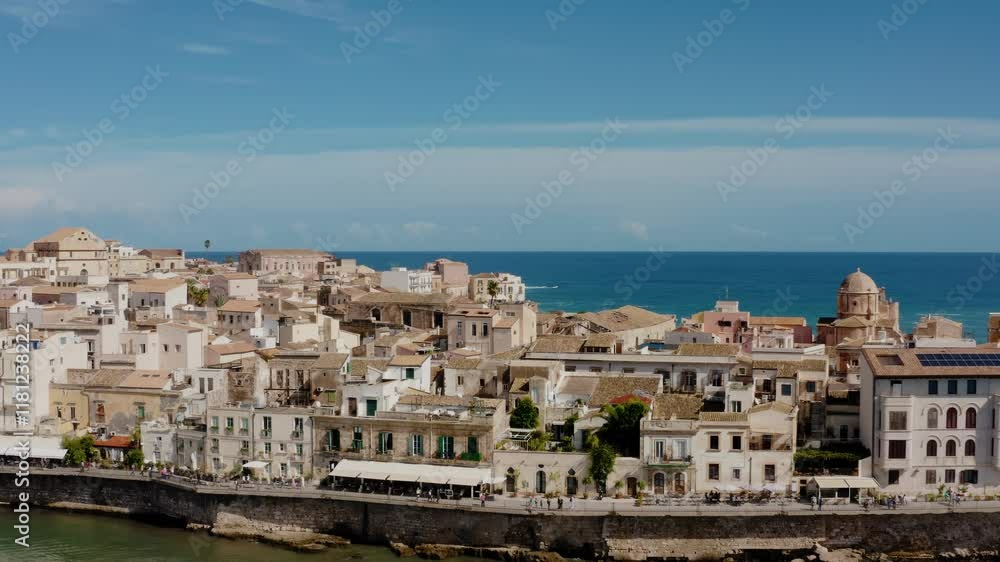 Aerial drone shot of Ortigia island. Old town in Syracuse. Historic architecture on a natural fortress by Mediterranean sea. UNESCO world heritage site in Sicily. Aerial drone shot of Ortigia island. Old town in Syracuse. Historic architecture on a natural fortress by Mediterranean sea. UNESCO world heritage site in Sicily.
