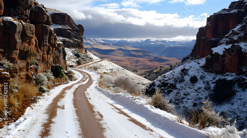 Top View of Snow-Covered Road in Valley with Truck on Asphalt Highway. photo