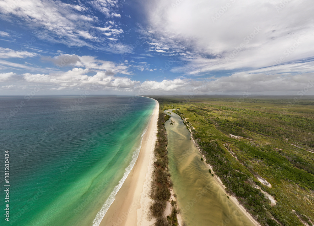 Aerial view of beautiful tropical beach and serene ocean with unspoiled coastline and blue sky, Fraser Island, Australia. Aerial view of beautiful tropical beach and serene ocean with unspoiled coastline and blue sky, Fraser Island, Australia.