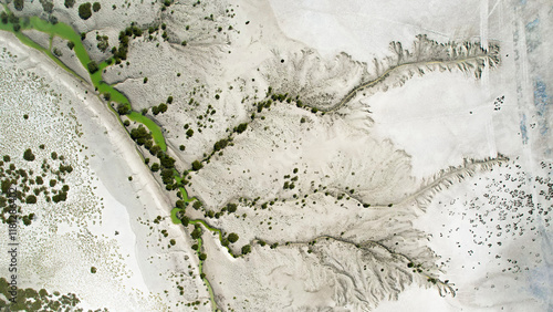 Aerial view of Willies Creek with abstract patterns of sand and vegetation, Kimberley Region, Australia.