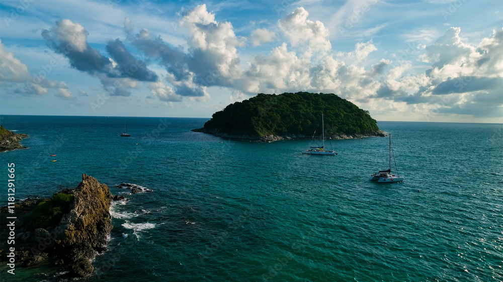 Aerial view of tranquil tropical islands with sailing boats under cloudy skies, Phuket Island, Thailand. Aerial view of tranquil tropical islands with sailing boats under cloudy skies, Phuket Island, Thailand.