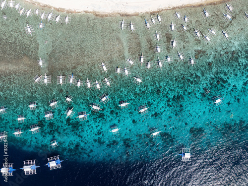 Aerial view of beautiful turquoise waters with boats along the coast, Panglao, Philippines. photo