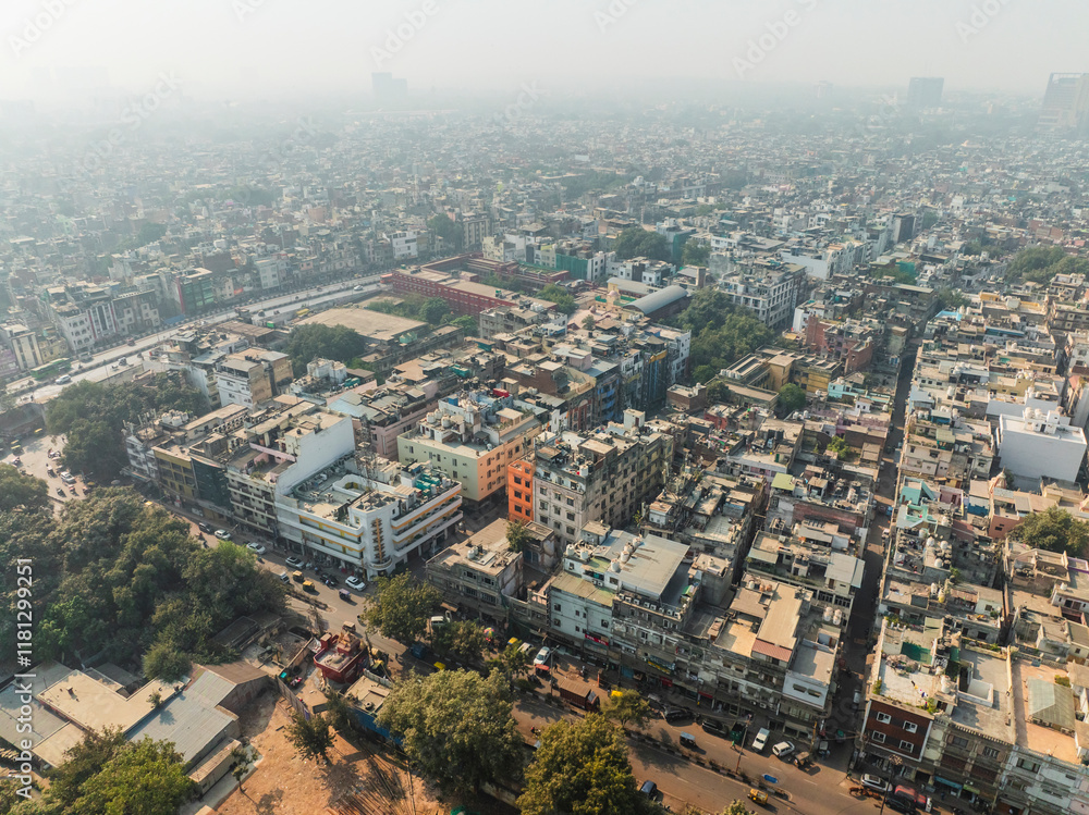 Aerial view of bustling urban landscape with dense buildings and busy streets, Paharganj, New Delhi, India. Aerial view of bustling urban landscape with dense buildings and busy streets, Paharganj, New Delhi, India.