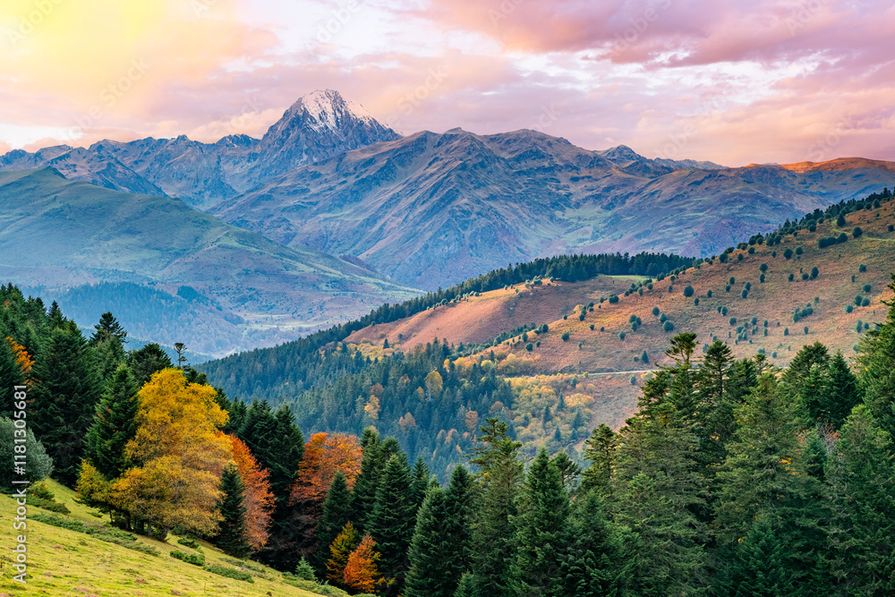Obraz premium The majestic Pyrenean peak of Pic du Midi d’Ossau rises above lush autumn forests and vibrant valleys, capturing nature’s harmony and beauty in stunning contrast.