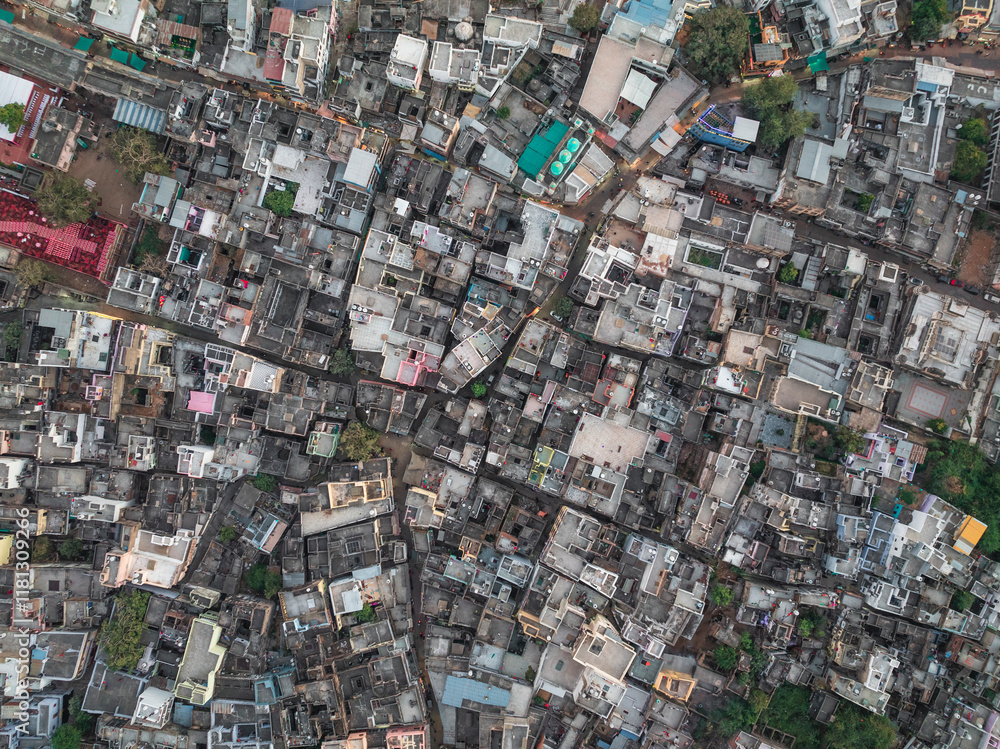 Aerial view of densely populated urban landscape with rooftops and street layout, Pushkar, India. Aerial view of densely populated urban landscape with rooftops and street layout, Pushkar, India.