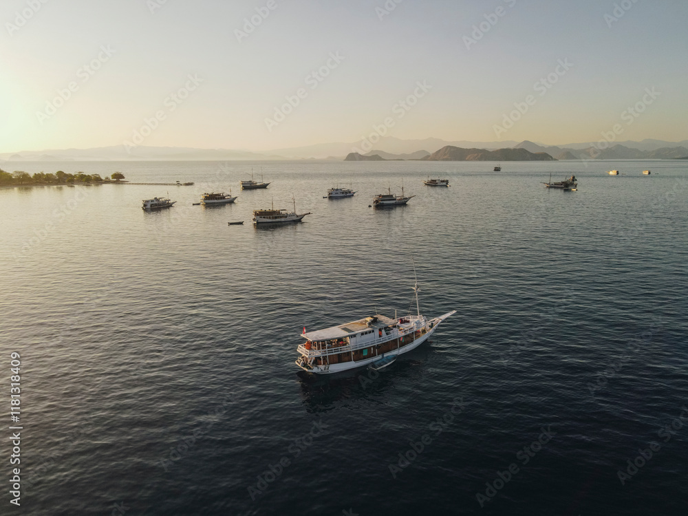 Aerial view of the beauty of Labuan Bajo is filled with a collection of traditional boats Pinisi. Aerial view of the beauty of Labuan Bajo is filled with a collection of traditional boats Pinisi.