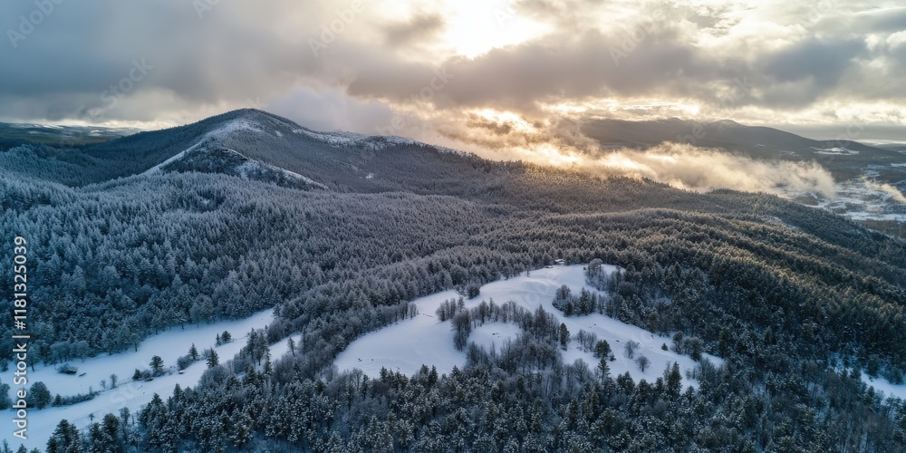 Obraz premium Aerial view of snowstorm clouds rolling over a mountain, dramatic contrast