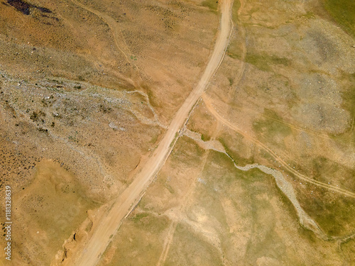 Aerial view of beautiful desert landscape with winding road and abstract patterns, Shandur, Pakistan. photo