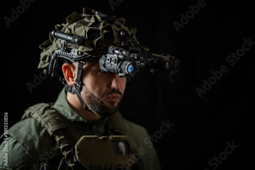 Canvas-taulu A modern special forces soldier using night vision monocular and thermal imaging in the darkness