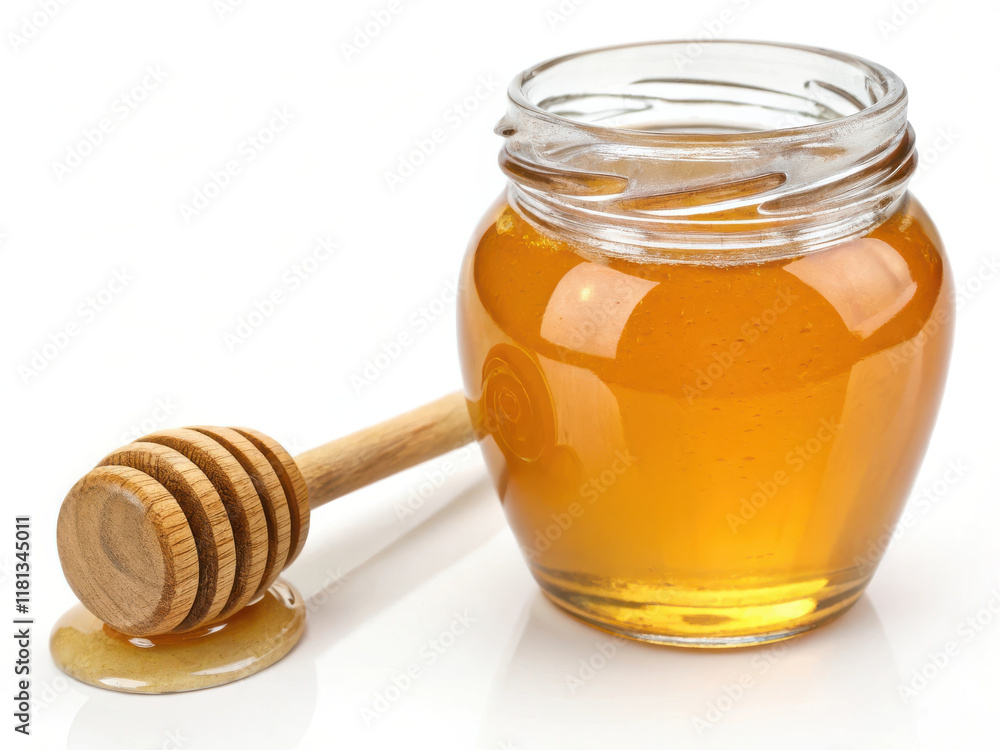shiny glass jar filled with golden honey and wooden dipper shiny glass jar filled with golden honey and wooden dipper