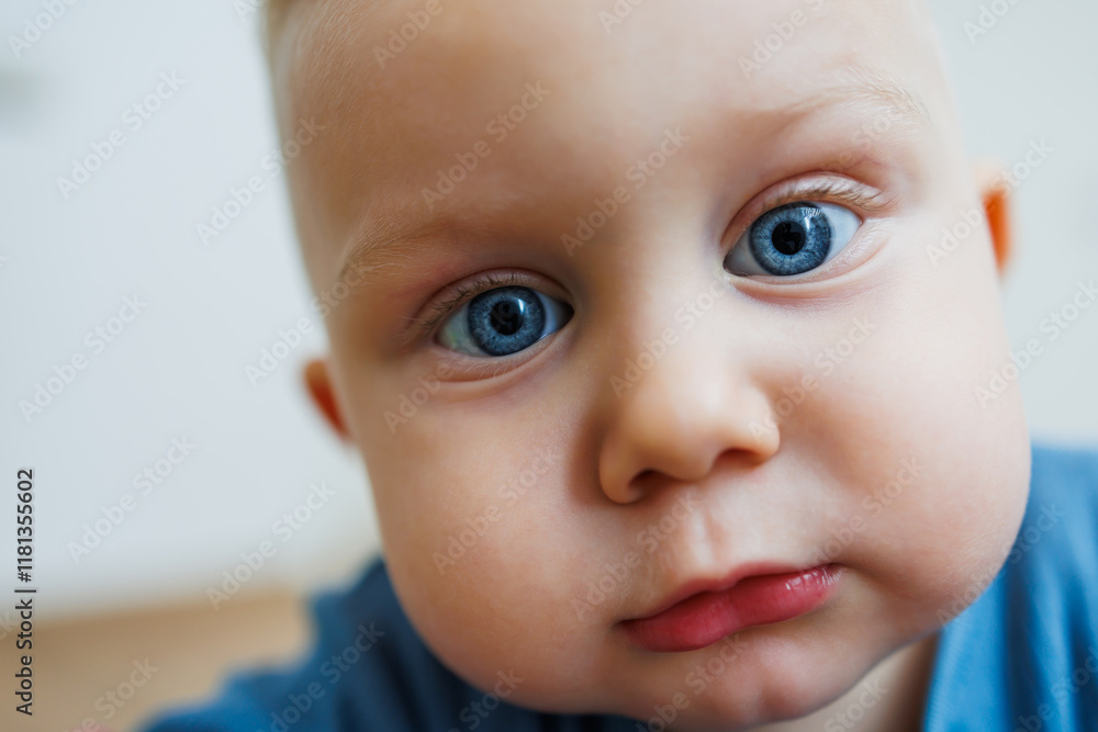 Little one-year-old boy with different emotions on his face close-up. Emotional baby. Cheerful boy. Blue-eyed toddler boy. Little one-year-old boy with different emotions on his face close-up. Emotional baby. Cheerful boy. Blue-eyed toddler boy.