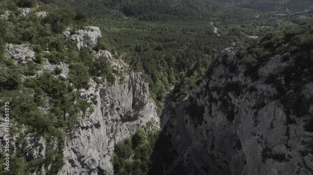 This drone video showcases an ascending crane shot over the stunning Boca del Infierno Gorge in the Western Valleys Natural Park, Huesca, Spain, revealing breathtaking mountain landscapes. This drone video showcases an ascending crane shot over the stunning Boca del Infierno Gorge in the Western Valleys Natural Park, Huesca, Spain, revealing breathtaking mountain landscapes.