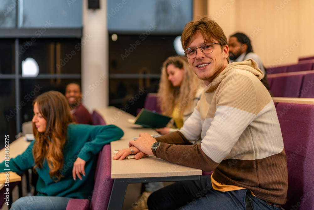 University student smiling during lesson in lecture hall with diverse classmates University student smiling during lesson in lecture hall with diverse classmates