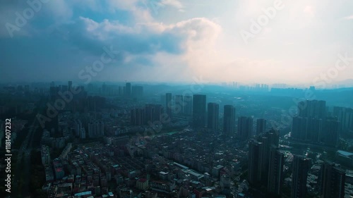 Aerial view of Longgang District showing urban landscape and skyline of Shenzhen City at dusk photo