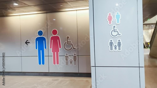 Motion of man and woman washroom logo on a wall