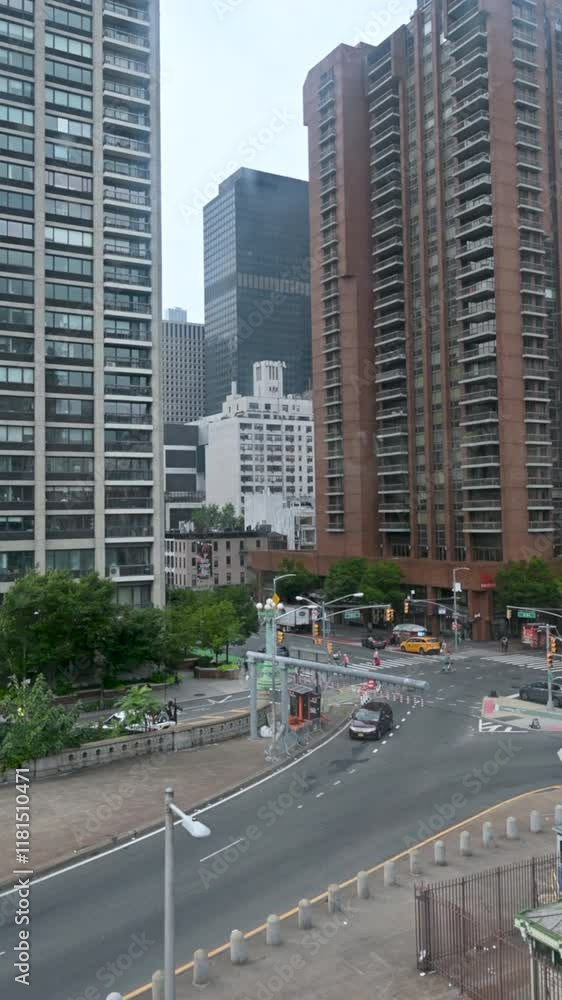 New York, USA, August 17, 2024. Iconic aerial POV footage from the Roosevelt Island cable car cabin. Manhattan skyscrapers pass us by. Vertical format. New York, USA, August 17, 2024. Iconic aerial POV footage from the Roosevelt Island cable car cabin. Manhattan skyscrapers pass us by. Vertical format.