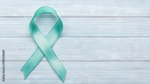 Ovarian and cervical cancer awarene ribbon isolated on wooden background with copy space photo