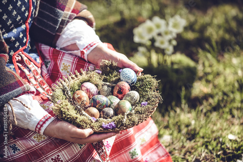 Sticker Woman in traditional Lithuanian clothes holding basket filled with Easter eggs