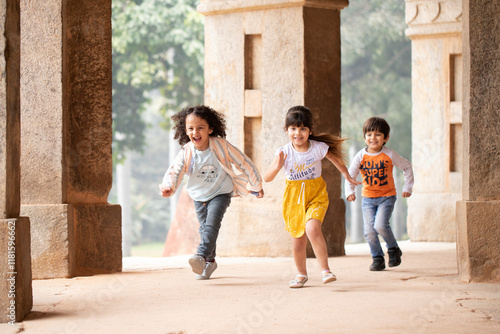Beautiful Kids Running Outdoor In Summer Day