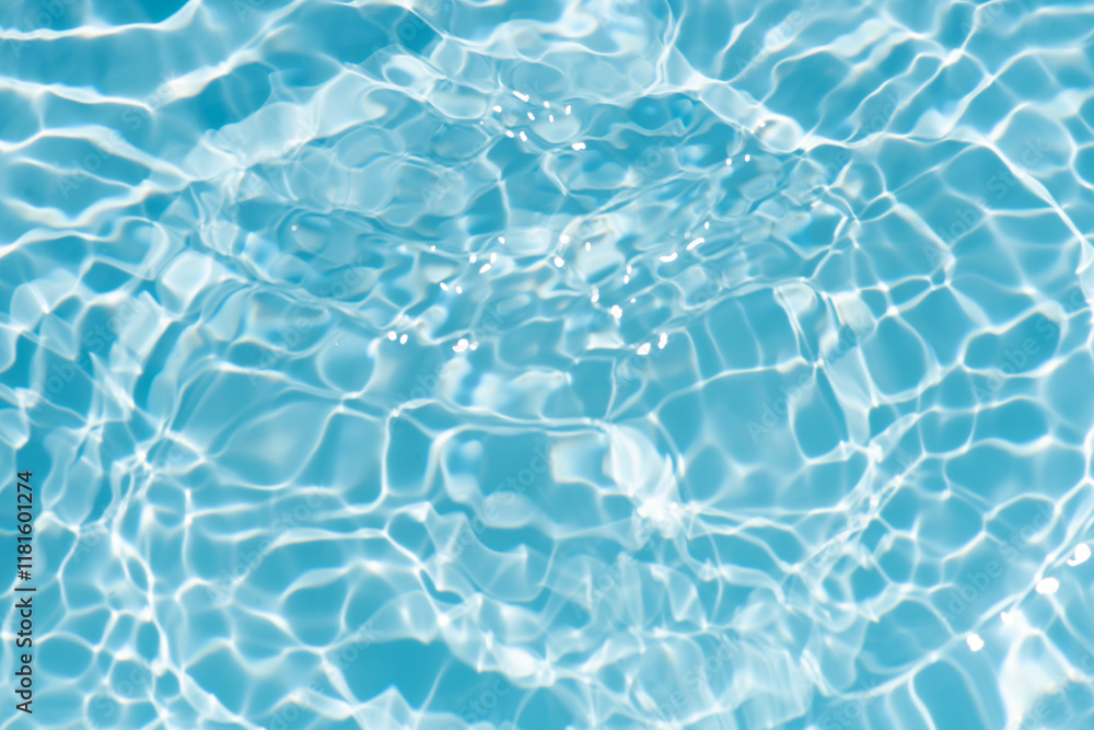 Obraz premium Bluewater waves on the surface ripples blurred. Defocus blurred transparent blue colored clear calm water surface texture with splash and bubbles. Water waves with shining pattern texture background.