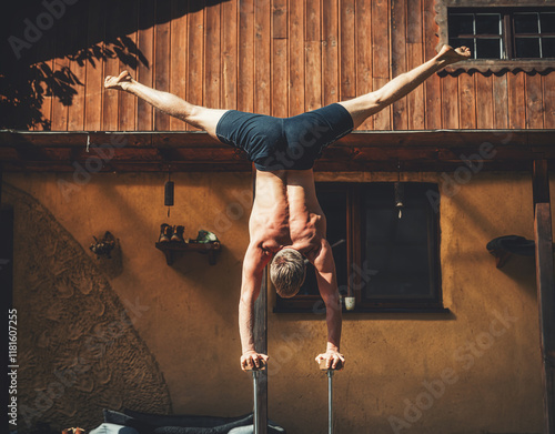 Man practicing yoga on a terrace. photo