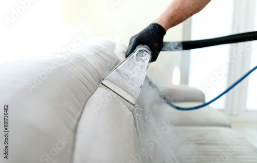 Cleaning concept. Sofa in the room. Virus prevention sanitizing inside. Process of deep furniture cleaning. Professionally chemical cleaning