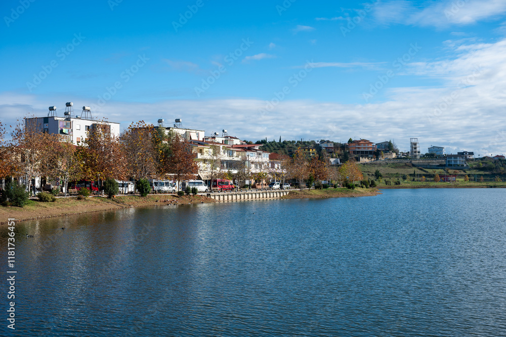 Naklejka premium Recreation zone at the touristical Belshi Lake, Albania