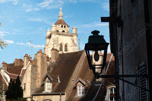 Photography Roof tops and church view of the beautiful architecture of Dole in the Jura region of France beside the River Doubs and Rhine-Rhone canal, a historical city located southeast of Dijon, France