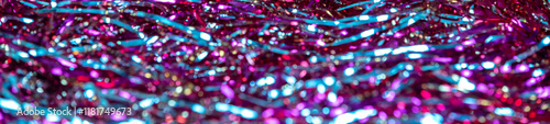 Unfocused abstract festive tinsel glitter background. Horizontal banner