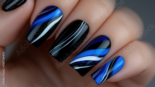 blue and black nail art with a black and white design photo