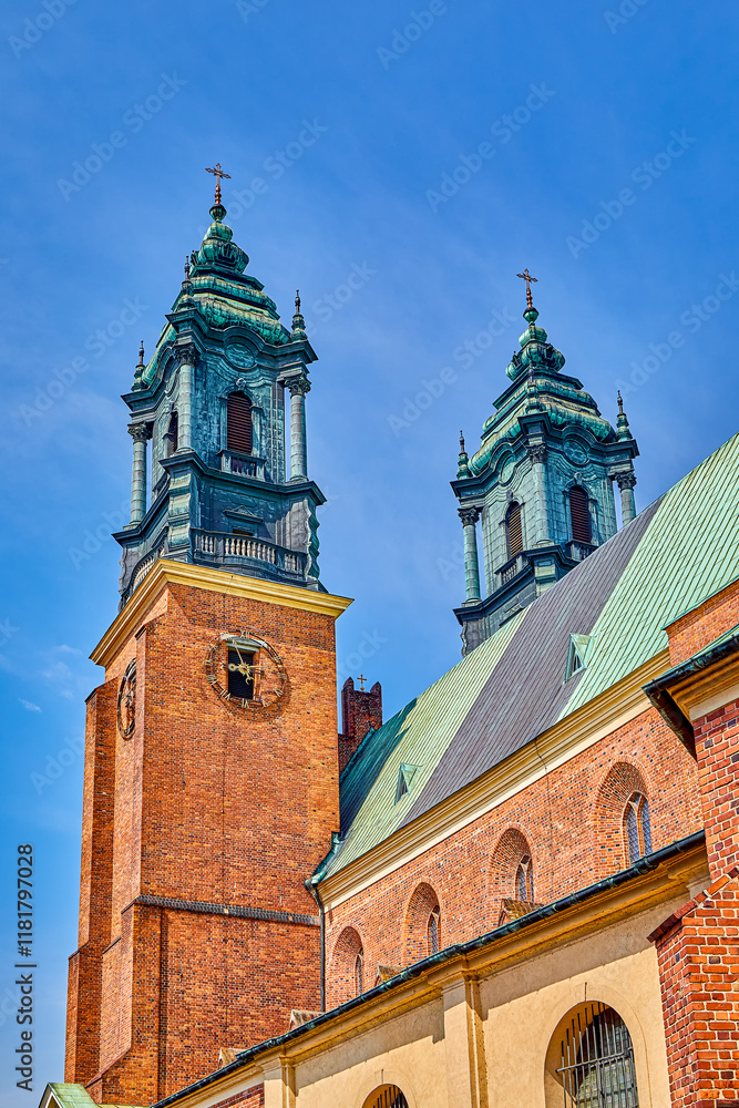 Obraz premium Bell towers and spires and religious cross on the Archcathedral Basilica of St. Peter and St. Paul in Poznan, Europe, Poland