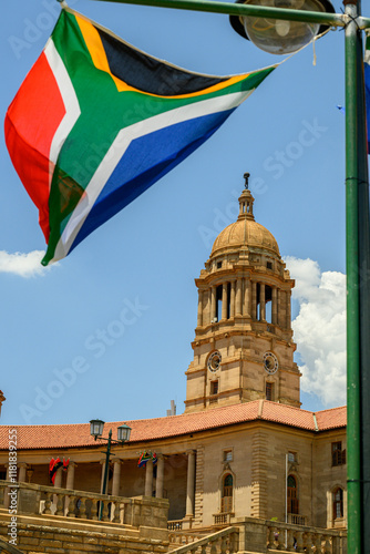 The South African flag with the Union Buildings in the background