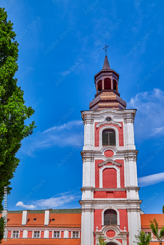 Obraz premium Courtyard and bell tower of the basilica Collegiate Church or simply know as Fara. It is a Roman Catholic basilica located in the heart of the Old Town district in Poznan, Europe, Poland