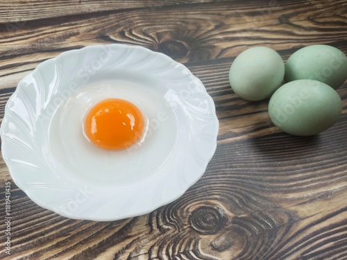 Duck eggs on a wooden table photo