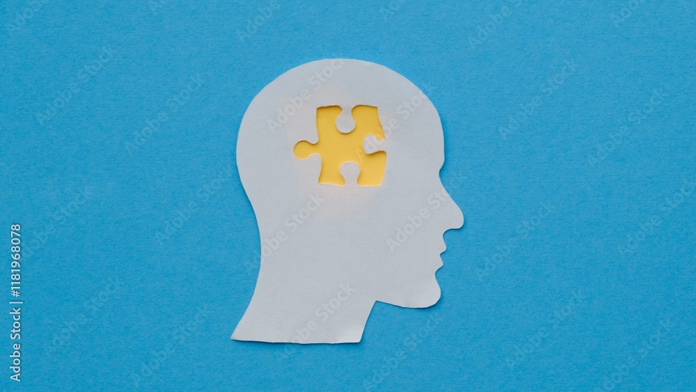 Holding a head with a puzzle piece, mental disease like Autism, Alzheimer, stroke awareness, brainstorming for ideas, memory problems Holding a head with a puzzle piece, mental disease like Autism, Alzheimer, stroke awareness, brainstorming for ideas, memory problems