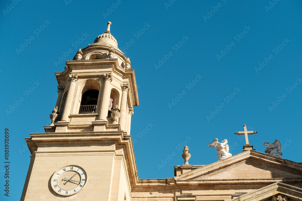 Pamplona cathedral showing clock and angels statues Pamplona cathedral showing clock and angels statues