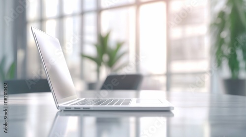 Wallpaper Mural A sleek laptop rests on a table in a modern office environment with natural light. Torontodigital.ca