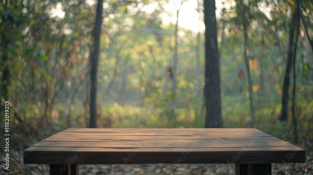 Wood table top in front of of trees in the forest. blur background image, for product display montage Wood table top in front of of trees in the forest. blur background image, for product display montage
