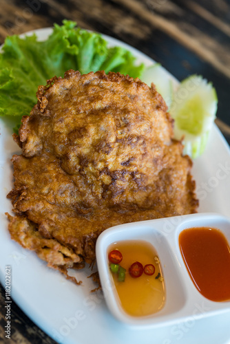 Jasmine rice topping with Thai style omelet stuffed minced pork. Thai called Kai jeow moo sab photo