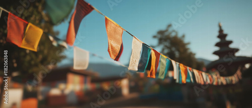 Himalayan prayer flags fluttering in the breeze under clear blue sky
