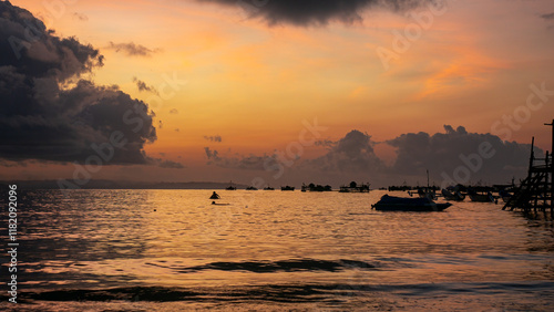 sunrise view with orange sky in pangandaran beach photo