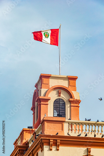 Peruvian flag at Port Captaincy of Callao, Grau Square - Callao, Peru photo